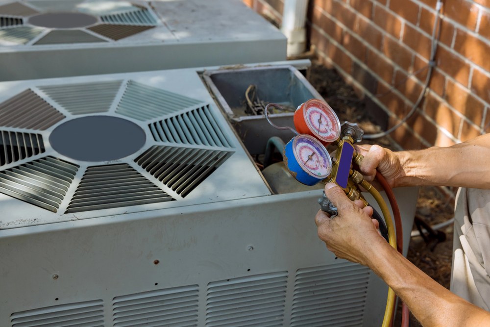 A man checks the air conditioner using a hose, ensuring proper maintenance and functionality.